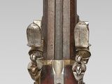 a very old gun that is on display on the table