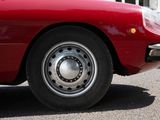 an image of a red car parked on the side of the road