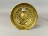 pair of antique brass candlesticks in the shape of a circle