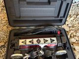 a case with tools in it sitting on the ground