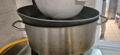 a large pot that is sitting on top of a stove