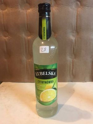 a bottle of lemonade sitting on a table