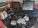a table with a lot of electronics on top of it