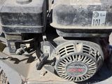 a close up of a small engine on the ground