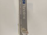 a box of toothpaste sitting on a white surface