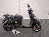 a scooter that is parked on a checkered floor