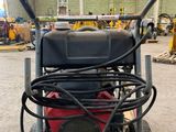 an image of a machine that is sitting on a pallet in a warehouse