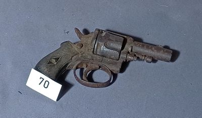a small gun with a tag on it on a table
