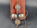 an old fashioned telephone that is sitting on a table