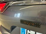a close up of the back of a car with a sticker on it