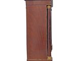 a tall wooden cabinet with a clock on top of it