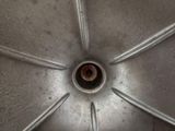 a close up view of a metal object with a hole in it