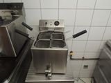 an image of a commercial fryer in a commercial kitchen
