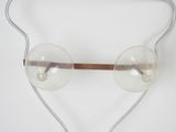 an image of a close up of a pair of glasses on a white surface