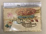 a card with a picture of a basket of flowers on it
