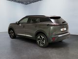 the rear view of a grey suv parked in a garage