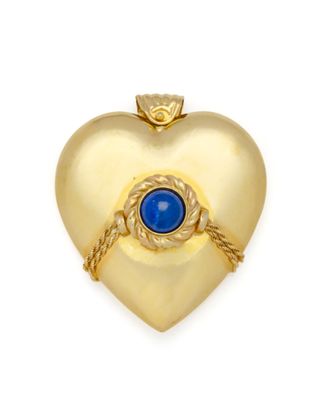 une image représentant un cadenas doré en forme de cœur, orné d'une pierre bleue en son centre