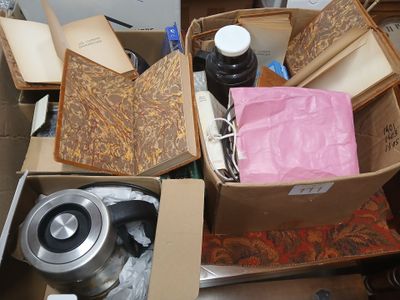 a pile of boxes that have various items in them