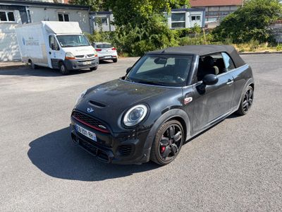 a small car that is parked in the parking lot