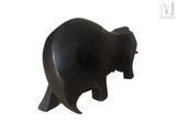 a black elephant statue on a white background