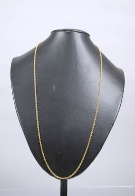 a black mannequin with a gold chain on it