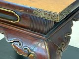 a wooden table with a drawer on top of it