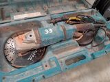 a blue box with a drill and other tools inside of it