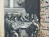 an open book with a picture of a group of people sitting at a table