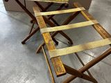 two wooden folding stools sitting next to each other in a room