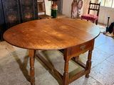 a wooden table with a wooden top in a room