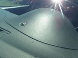the sun shines through the windshield of a car as it sits in the passenger seat