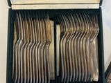 a box of silverware that is sitting on a table