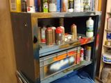 a shelf with cans and cans on it in a room