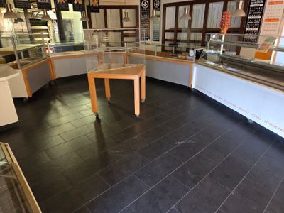 an image of a store with a counter and a display case