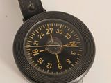 a watch that is sitting on a white surface