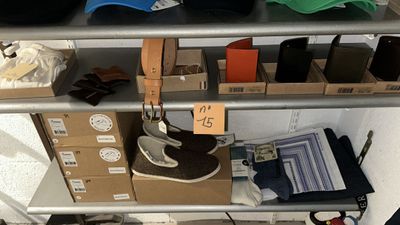 many hats and other items on a shelf in a store