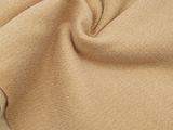 a close up of a tan blanket with fringes on it