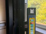 a view of a vending machine on the side of a train