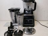 a blender that is sitting on a table next to a blender