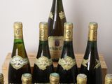 many bottles of wine sitting in a wooden crate