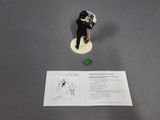 a figurine of a man with a hat and a cane