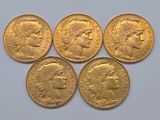 four gold sovereigns, one of which is a sovereign and the other of which is a sovereign