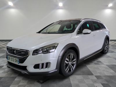 a picture of a white suv parked in a garage