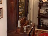 a grandfather clock in the corner of the room