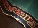 a close up of a table with a green table cloth on it