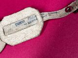 a pair of scissors that are laying on a pink cloth