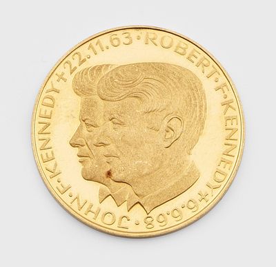 an image of a close up of a gold coin with a man ' s face on it