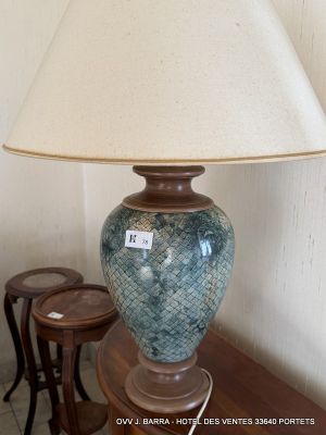a lamp that is sitting on a table next to two stools