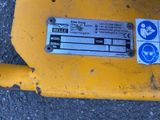 a close up of a sign on the side of a yellow vehicle