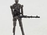 figurine of a soldier with a machine gun on a white surface